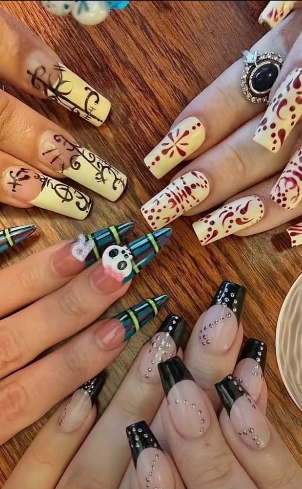 Hand-painted, plaid, and black French tip nail sets by Gracie